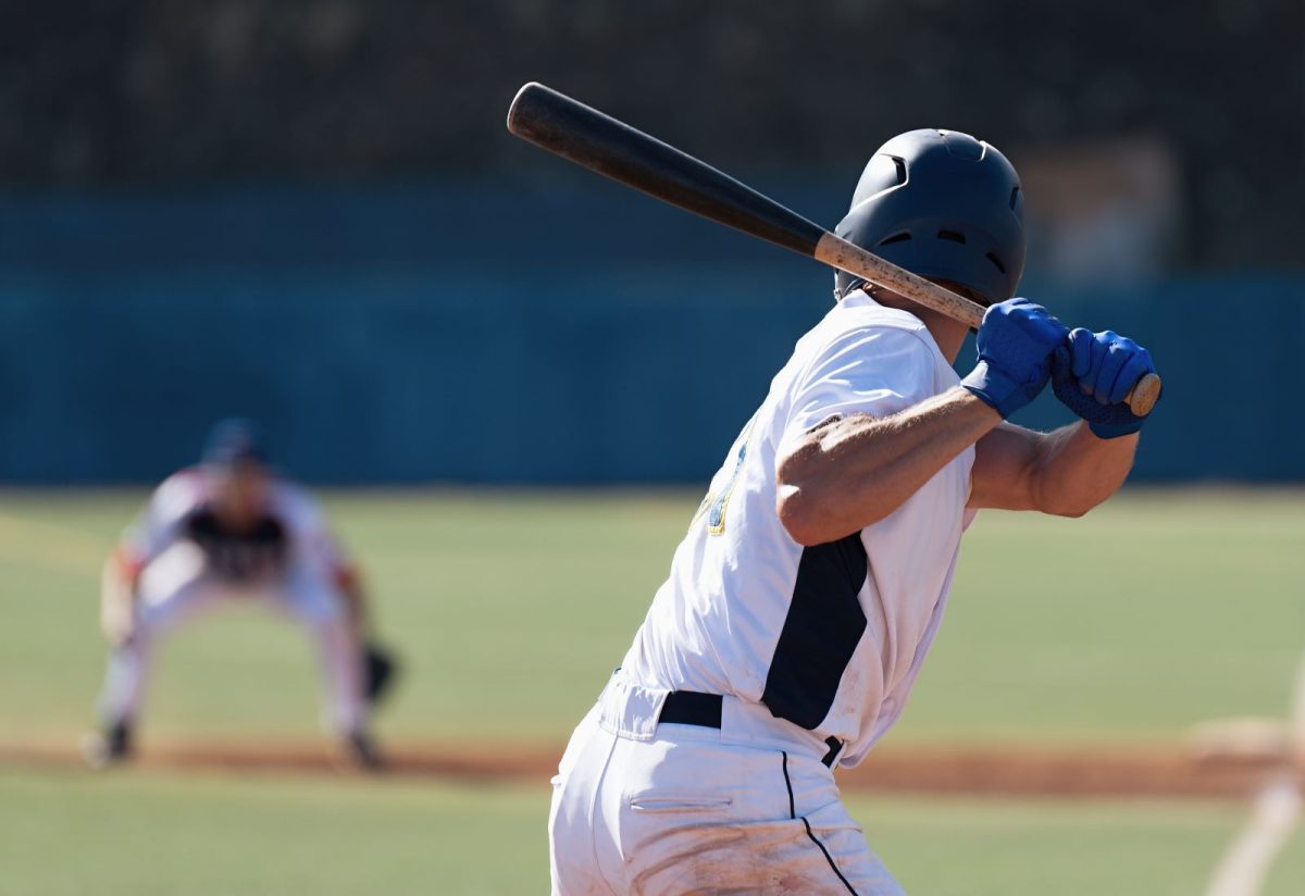 baseball player swinging bat